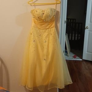 Yellow tie back ball gown